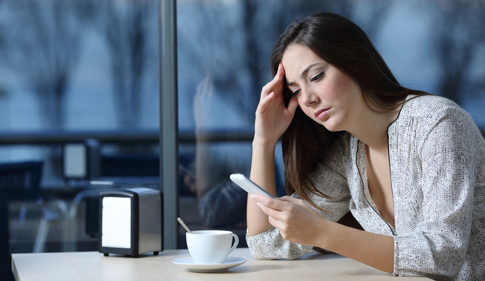 person looking at phone getting divorced