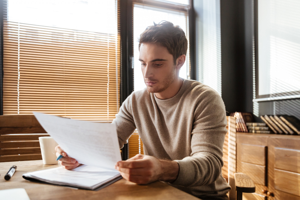 Person preparing financial documents before filing for divorce in New Jersey